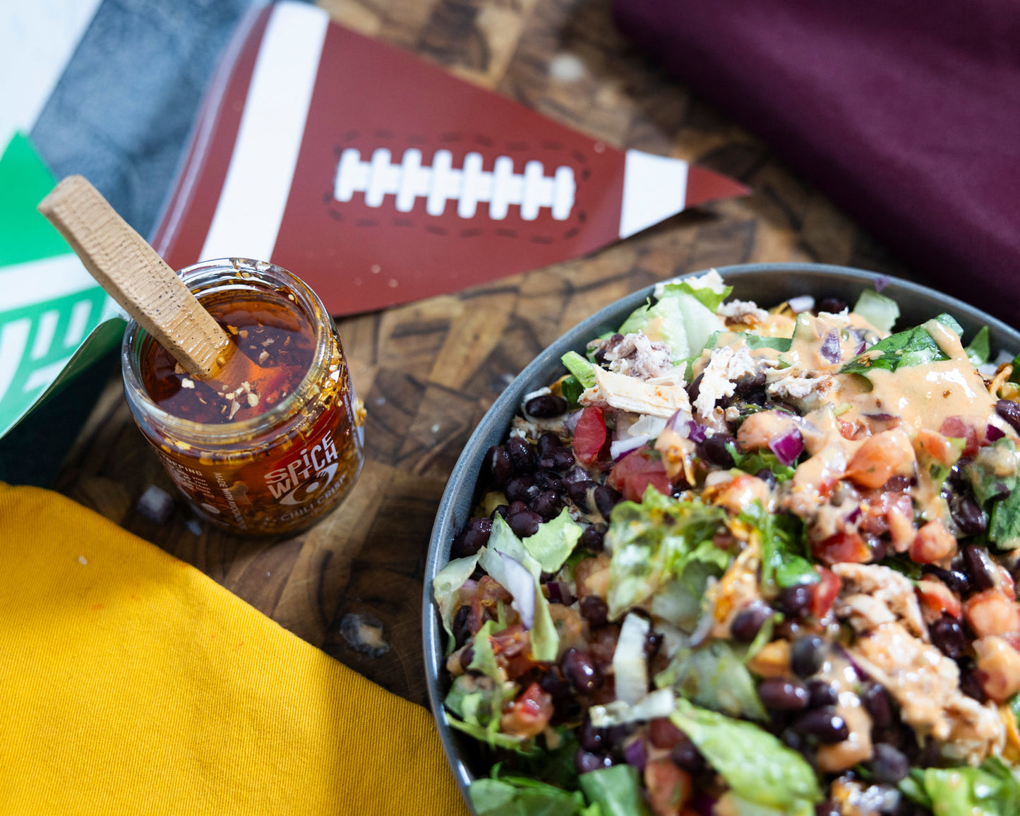 Loaded nachos topped with Spice Witch Chili Crisp for game day