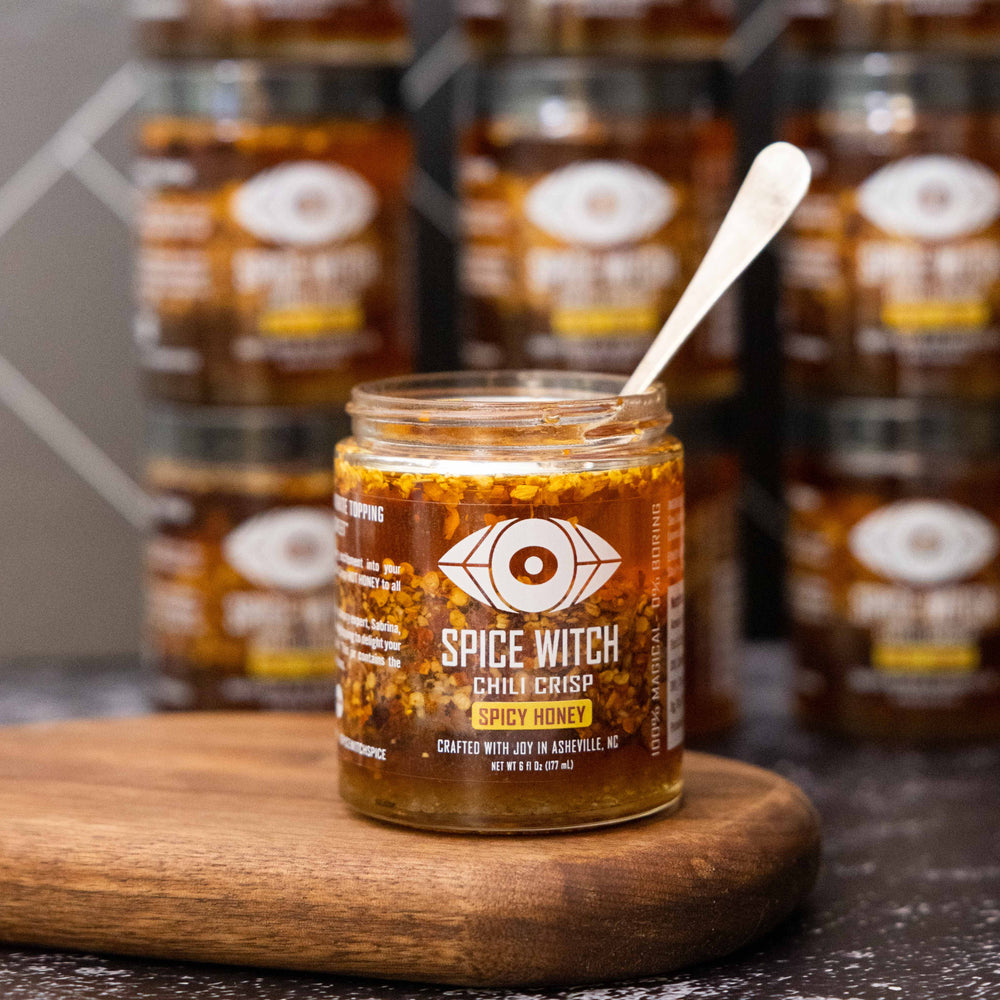 
                  
                    Jar of Spice Witch Chili Crisp with a Spicy Honey Twist, highlighting its unique combination of spicy, crunchy, and sweet flavors. Perfect for enhancing pizza, pasta, grilled meats, and more.
                  
                