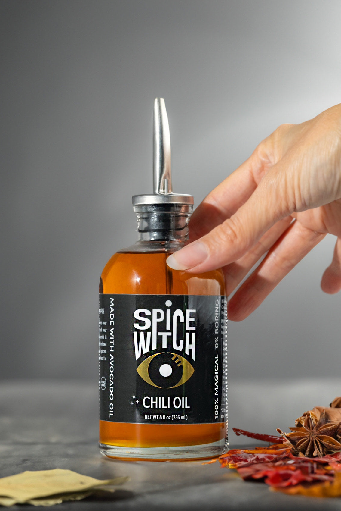 
                  
                    Spice Witch Chili Oil - Discover bold flavor with Spice Witch Chili Oil, made with premium avocado oil, garlic, ginger, and aromatic spices. This versatile chili oil adds a spicy kick to any dish, perfect for cooking, drizzling, and dipping. Enhance stir-fries, soups, marinades, pizzas, pastas, salads, and vegetables with its rich, savory notes. Elevate your culinary creations with this essential gourmet condiment.
                  
                