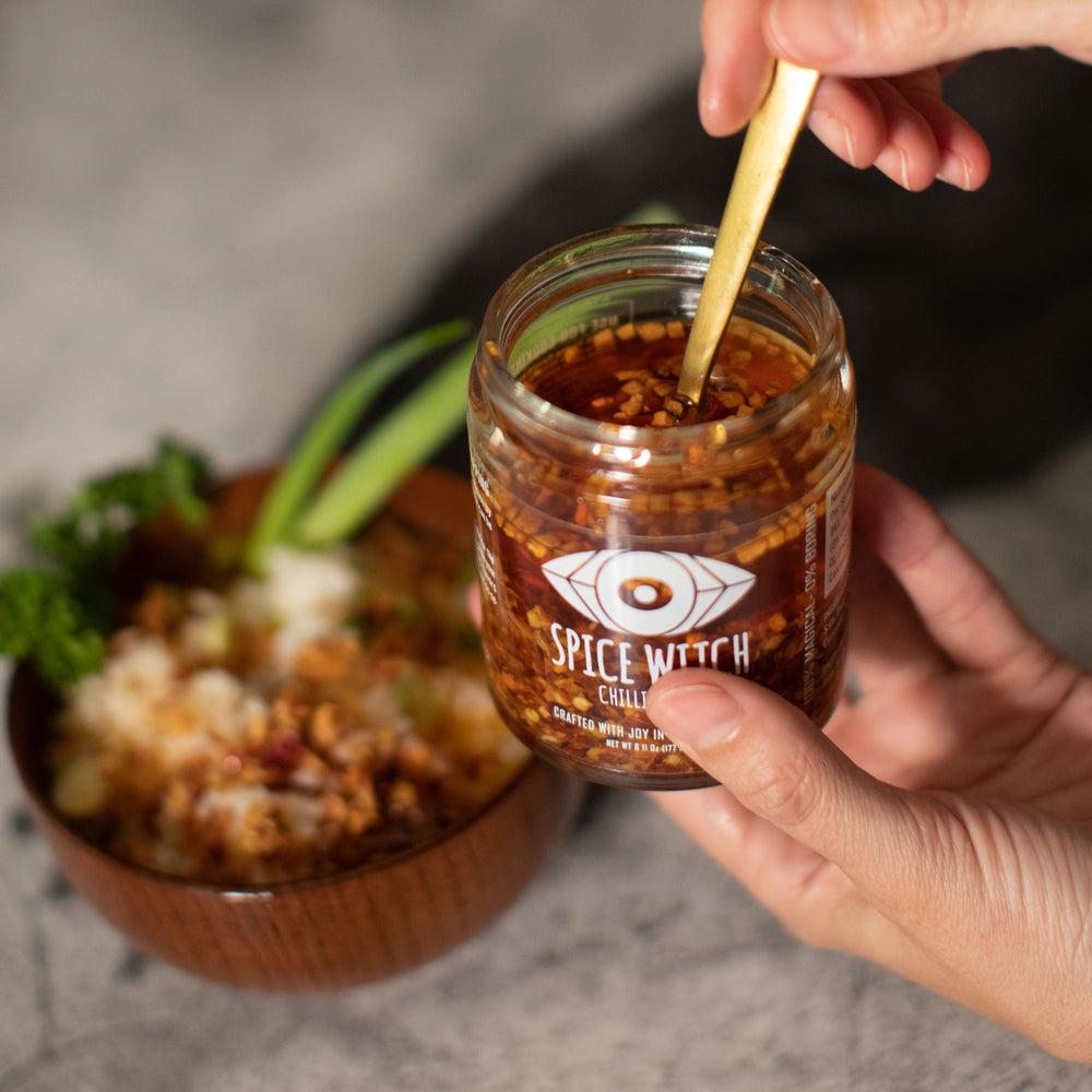 
                  
                    Spice Witch Chili Crisp in avocado oil base with garlic, ginger, dried onions, shallots, chili flakes, and sea salt. Perfect for adding flavorful crunch to pizza, pasta, and more. Versatile, healthy, and delicious condiment
                  
                