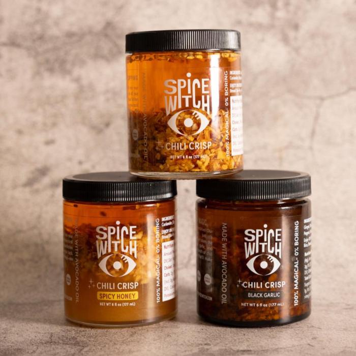 "Three versions of Spice Witch Chili Crisp displayed in jars: Classic, Black Garlic, and Spicy Honey, highlighting the unique ingredients that bring bold, layered flavors to your dishes."